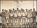 Boys basketball team with Coach Brissey and Randy Snipes, Manager.